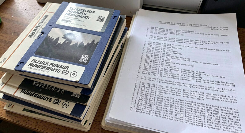A stack of labeled 3.5 inch floppy disks beside printed software manuals and a dot matrix printout.